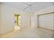 Bedroom featuring open closet and en-suite bathroom with tile floor and vanity at 3800 Bal Harbor Blvd # 212, Punta Gorda, FL 33950