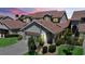 Charming exterior view of home with tile roof, attached garage, and beautiful landscaping at 3800 Bal Harbor Blvd # 212, Punta Gorda, FL 33950