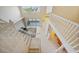 Overhead view of the bright foyer with staircase, tile flooring, and soaring ceilings at 3800 Bal Harbor Blvd # 212, Punta Gorda, FL 33950