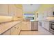 Well-equipped kitchen with granite countertops, stainless steel appliances, and a view of the canal at 3800 Bal Harbor Blvd # 212, Punta Gorda, FL 33950