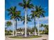 Community entrance with palm trees and fountain at 255 W End Dr # 3202, Punta Gorda, FL 33950