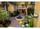 Community courtyard with fountain and tropical plants at 255 W End Dr # 3202, Punta Gorda, FL 33950