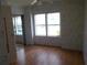 Bright bedroom featuring wood flooring at 5787 Holiday Park Blvd, North Port, FL 34287