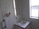 Small bathroom with sink and mirror at 5787 Holiday Park Blvd, North Port, FL 34287