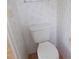 Bathroom toilet and floral wallpaper at 5787 Holiday Park Blvd, North Port, FL 34287