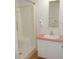 Bathroom with shower stall, vanity with sink, and floral wallpaper at 5787 Holiday Park Blvd, North Port, FL 34287