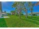 Large backyard with green grass and a patio at 4582 Enid Ln, North Port, FL 34288
