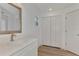 Simple bathroom with white vanity and flooring at 4582 Enid Ln, North Port, FL 34288