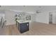 Bright living room with light wood floors and ceiling fan at 4582 Enid Ln, North Port, FL 34288