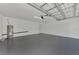 Spacious garage with gray epoxy floor and water heater at 4582 Enid Ln, North Port, FL 34288