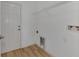Laundry room with built in shelving and flooring at 4582 Enid Ln, North Port, FL 34288