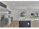 Modern kitchen with stainless steel appliances and a large island at 4582 Enid Ln, North Port, FL 34288