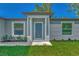 Newly built home with a modern dark gray front door at 4582 Enid Ln, North Port, FL 34288