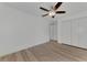 Bright bedroom with ceiling fan and wood-look floors at 4582 Enid Ln, North Port, FL 34288