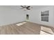 Bright bedroom with two windows and ceiling fan at 4582 Enid Ln, North Port, FL 34288
