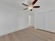 Spacious bedroom with ceiling fan and double doors at 4582 Enid Ln, North Port, FL 34288