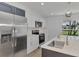 Modern kitchen with stainless steel appliances and white cabinets at 4582 Enid Ln, North Port, FL 34288