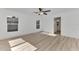 Spacious bedroom with light wood floors and ceiling fan at 4582 Enid Ln, North Port, FL 34288