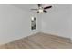Bright bedroom with ceiling fan and wood-look floors at 4582 Enid Ln, North Port, FL 34288