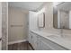 Updated bathroom with double vanity, quartz countertop and walk-in shower at 1019 Cazenovia St, Port Charlotte, FL 33952