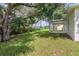Large backyard with mature tree providing shade and privacy at 1019 Cazenovia St, Port Charlotte, FL 33952