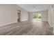 Spacious living area with vinyl flooring and sliding glass doors at 1019 Cazenovia St, Port Charlotte, FL 33952