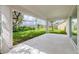 Covered patio with view of backyard and surrounding landscape at 1019 Cazenovia St, Port Charlotte, FL 33952