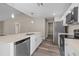 Modern kitchen with island, stainless steel appliances, and white cabinets at 1019 Cazenovia St, Port Charlotte, FL 33952