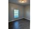 Bright bedroom with hardwood floors and window at 1548 Eugenia Ave, North Port, FL 34288