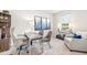 Home office space featuring a desk, shelving, and a cozy sitting area at 16423 Bridle Ridge St, Port Charlotte, FL 33953