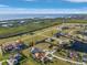Aerial view showcases house in waterfront community, with nearby water and marsh views at 24051 Pyramid Way, Punta Gorda, FL 33955