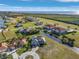 Real estate aerial shot of a waterfront community, with homes, green space, and water views at 24051 Pyramid Way, Punta Gorda, FL 33955