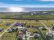 Aerial shot of home in waterfront community, showcasing water views and nearby homes at 24051 Pyramid Way, Punta Gorda, FL 33955
