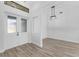Bright entryway features a set of glass double doors and light, wood-look floors at 24051 Pyramid Way, Punta Gorda, FL 33955
