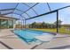 Inviting screened-in pool surrounded by lush landscaping, with the residence just steps away at 24051 Pyramid Way, Punta Gorda, FL 33955