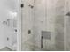 Close-up of a tiled shower featuring modern fixtures and a convenient niche for storage at 24051 Pyramid Way, Punta Gorda, FL 33955