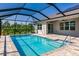 Beautiful screened-in pool with a tiled deck and seamless access to the home at 27261 Guapore Dr, Punta Gorda, FL 33983