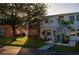 Two-story condo building with a grassy yard and walkway at 4158 Tamiami Trl # U6, Port Charlotte, FL 33952