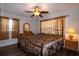 Spacious bedroom with king-size bed, ceiling fan, and wood floor at 4158 Tamiami Trl # U6, Port Charlotte, FL 33952