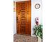 Ornate wood front door with floral carvings at 4158 Tamiami Trl # U6, Port Charlotte, FL 33952