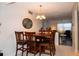 Bright dining room with a wood table and chairs, chandelier lighting at 4158 Tamiami Trl # U6, Port Charlotte, FL 33952