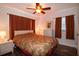 Bedroom with a double bed, ceiling fan and wood-look flooring at 4158 Tamiami Trl # U6, Port Charlotte, FL 33952