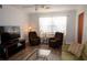 Living room with two armchairs, sofa, and coffee table at 4158 Tamiami Trl # U6, Port Charlotte, FL 33952