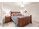 Spacious bedroom with a wooden bed frame and en-suite bathroom access at 14161 Heritage Landing Blvd # 1117, Punta Gorda, FL 33955