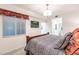 Guest bedroom with a wooden bed frame and en-suite bathroom at 14161 Heritage Landing Blvd # 1117, Punta Gorda, FL 33955