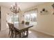 Bright dining room with chandelier and table for six at 27261 Guapore Dr, Punta Gorda, FL 33983