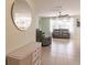 Spacious living room with gray reclining sofas and tile flooring at 27261 Guapore Dr, Punta Gorda, FL 33983