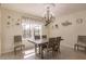 Spacious dining area with chandelier and view of pool at 27261 Guapore Dr, Punta Gorda, FL 33983