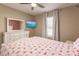 Bright bedroom with flamingo bedding, dresser, and large window at 27261 Guapore Dr, Punta Gorda, FL 33983