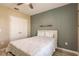 Bedroom with double doors and a wall-mounted shelf at 27261 Guapore Dr, Punta Gorda, FL 33983